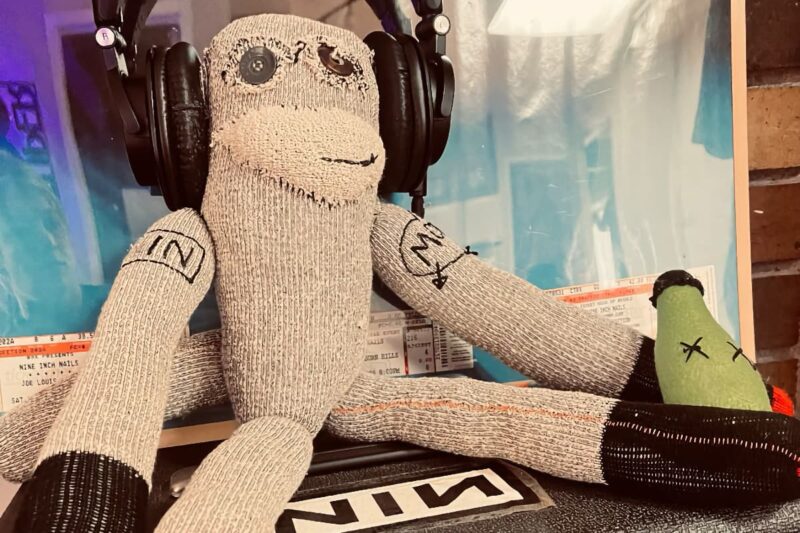 sock monkey wearing headphones